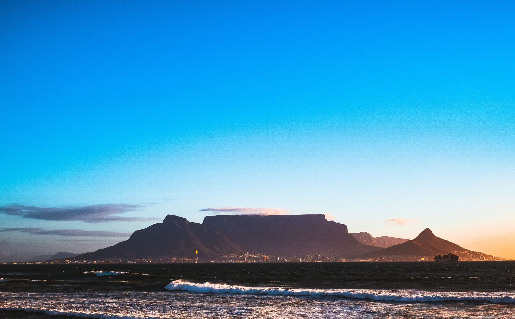 Table Mountain across Table Bay at dusk, seen from Bloubergstrand