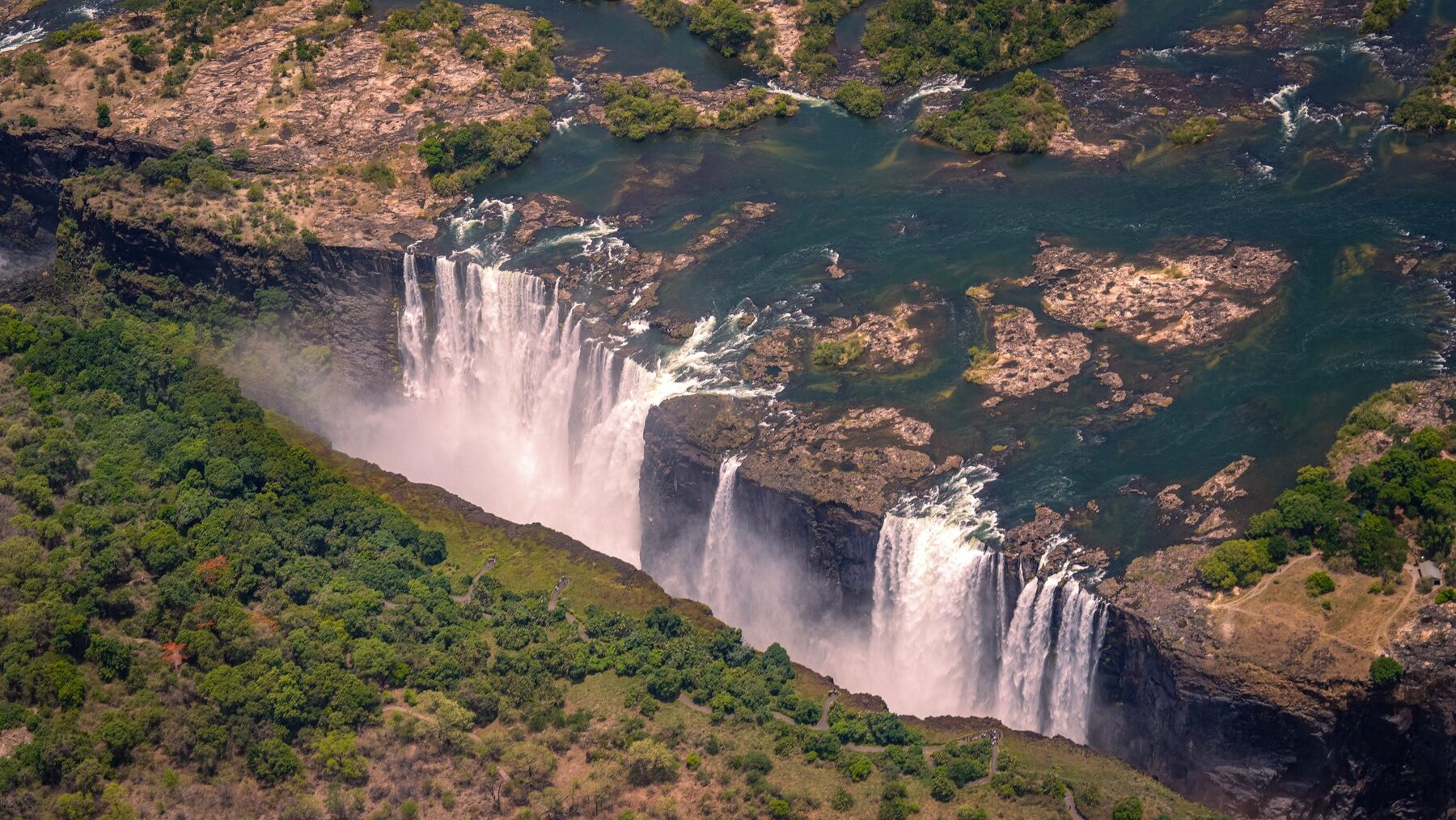 Victoria Falls from the air, the full width of the Zambezi dropping into the gorge
