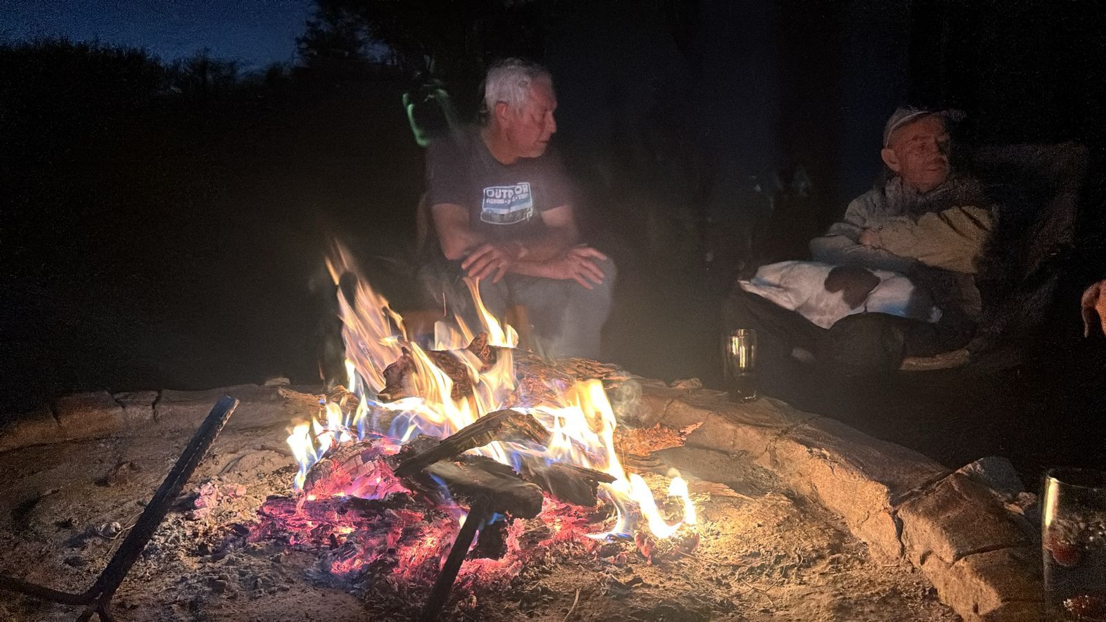 Hunters around the evening fire at a Nhoro Safaris camp in Zimbabwe