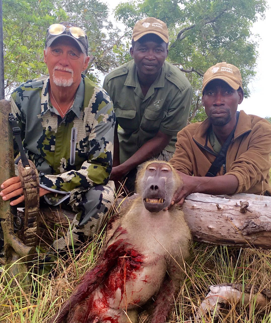 Hunting party with a chacma baboon male taken on the Nhoro Safaris concession in Limpopo, South Africa
