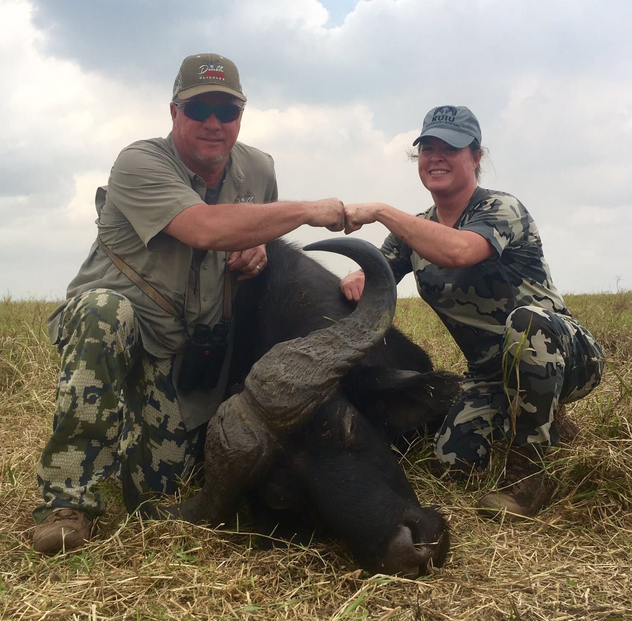 Two hunting clients celebrating a Cape buffalo bull taken in the Zambezi Delta, Mozambique