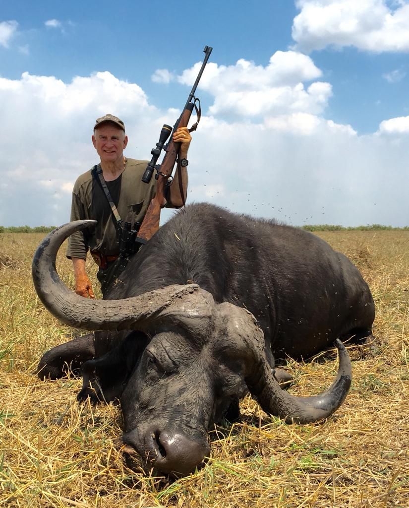 Hunter with a wide-horned Cape buffalo bull taken in the Zambezi Delta, Mozambique