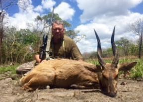 Hunter with a bushbuck ram taken in the Zambezi Delta, Mozambique