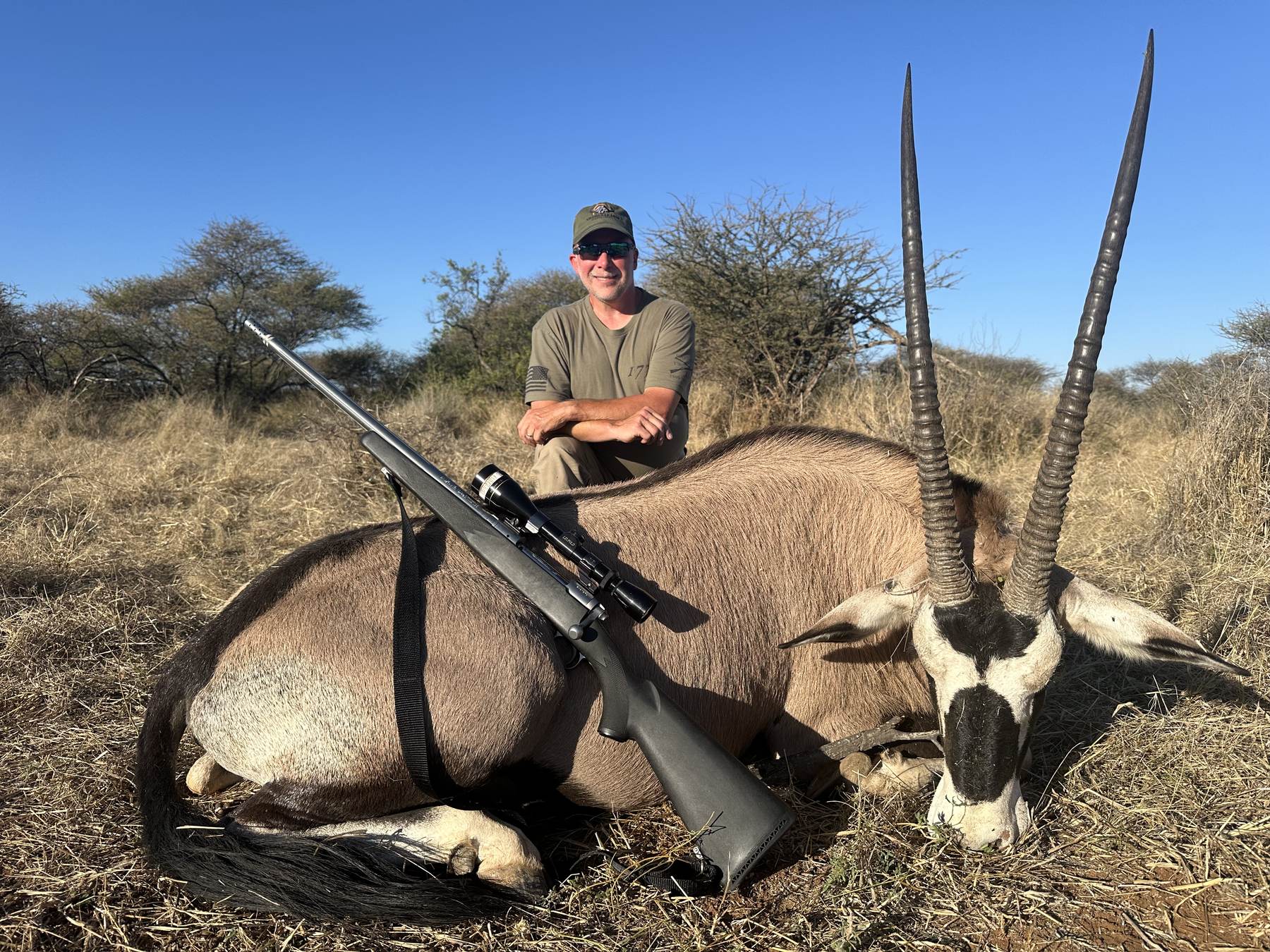 Hunting client with a gemsbok bull taken in the Kalahari, Botswana