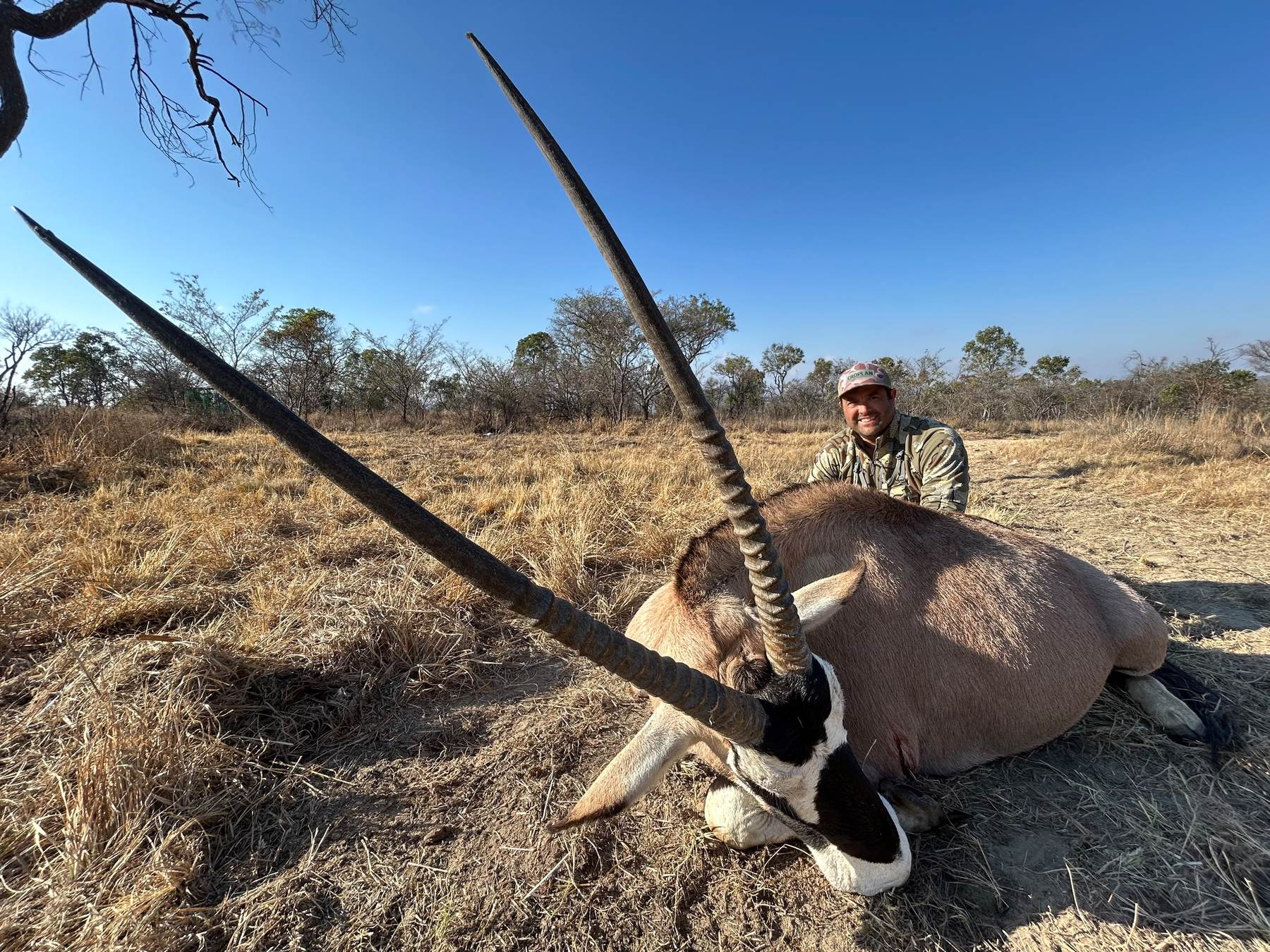 Hunting client with a long-horned gemsbok bull, South Africa
