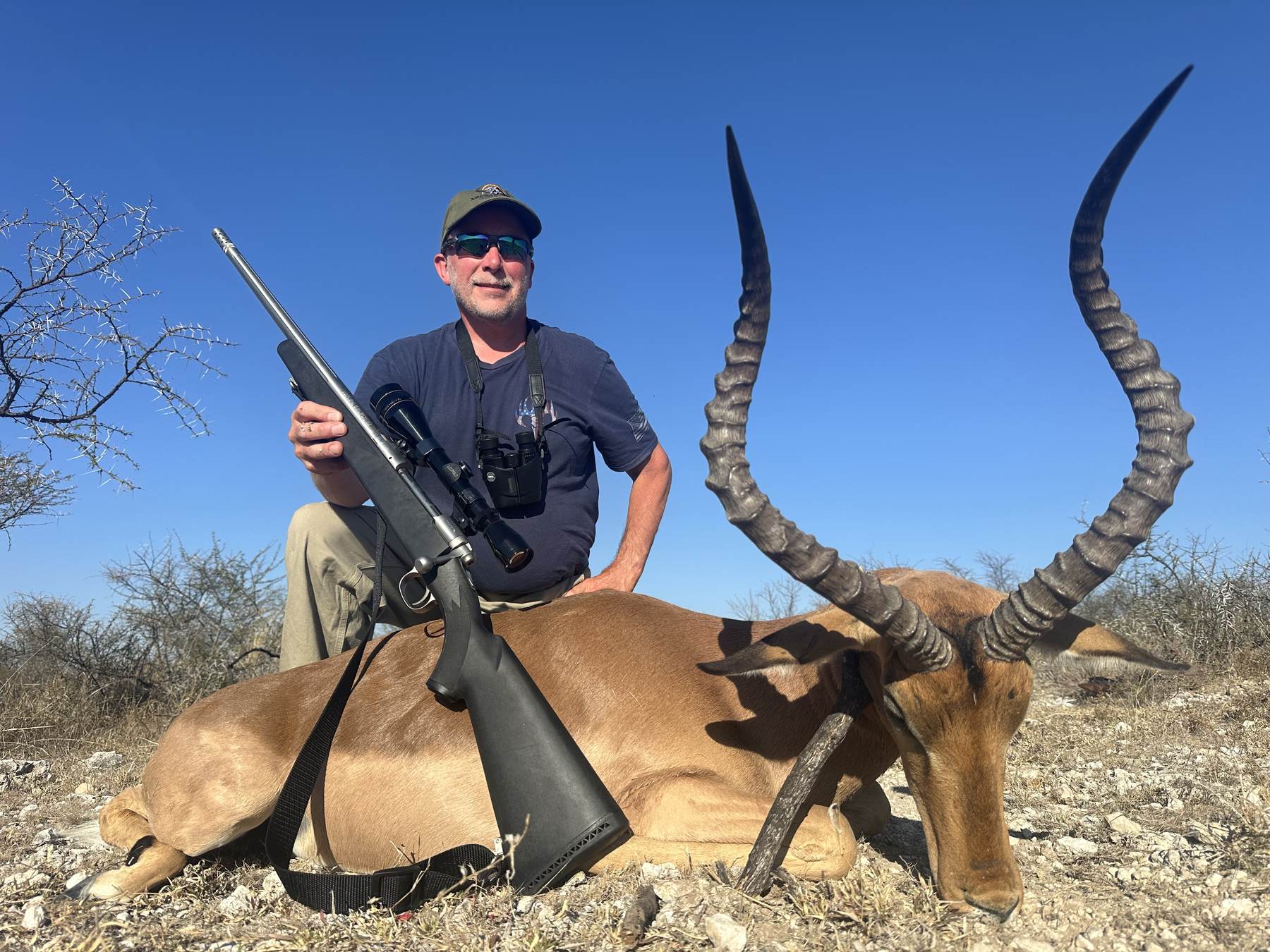 Hunting client with a long-horned impala ram taken in Limpopo, South Africa