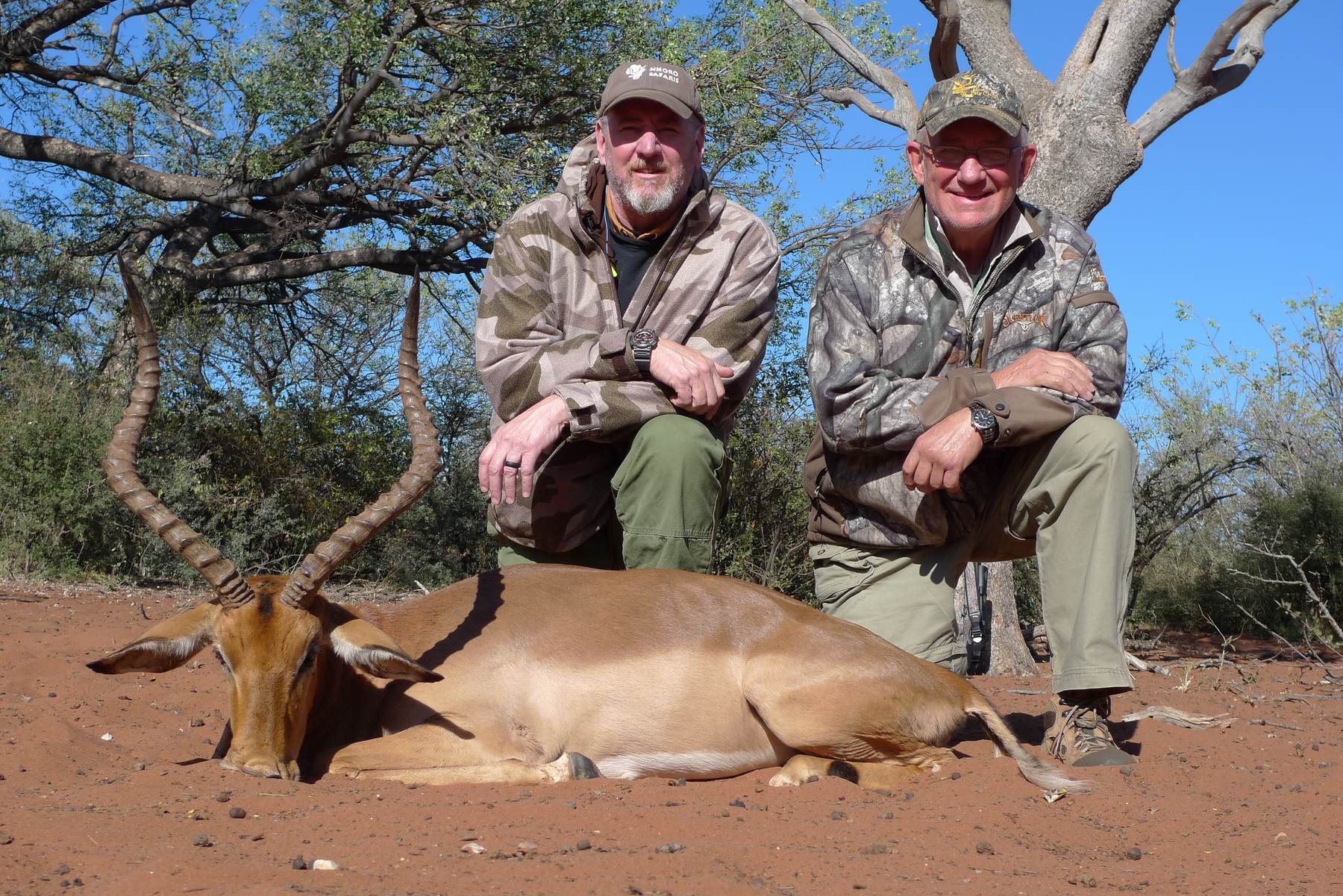 Two hunting clients with an impala ram taken in Limpopo, South Africa