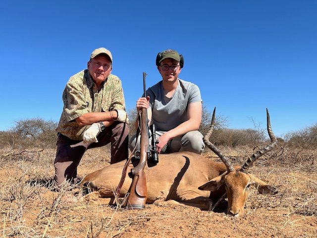 Two hunting clients with an impala ram taken in Limpopo, South Africa