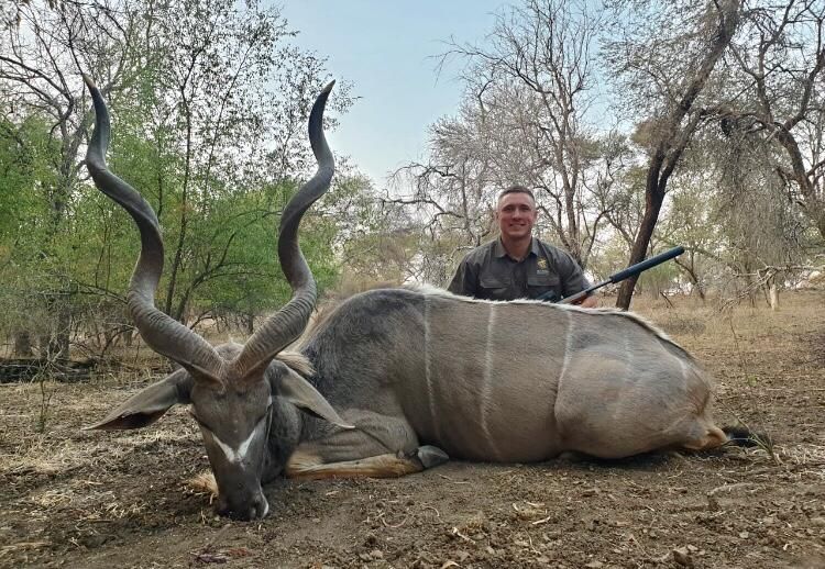 Hunting client with a deep-curled kudu bull taken in Limpopo, South Africa
