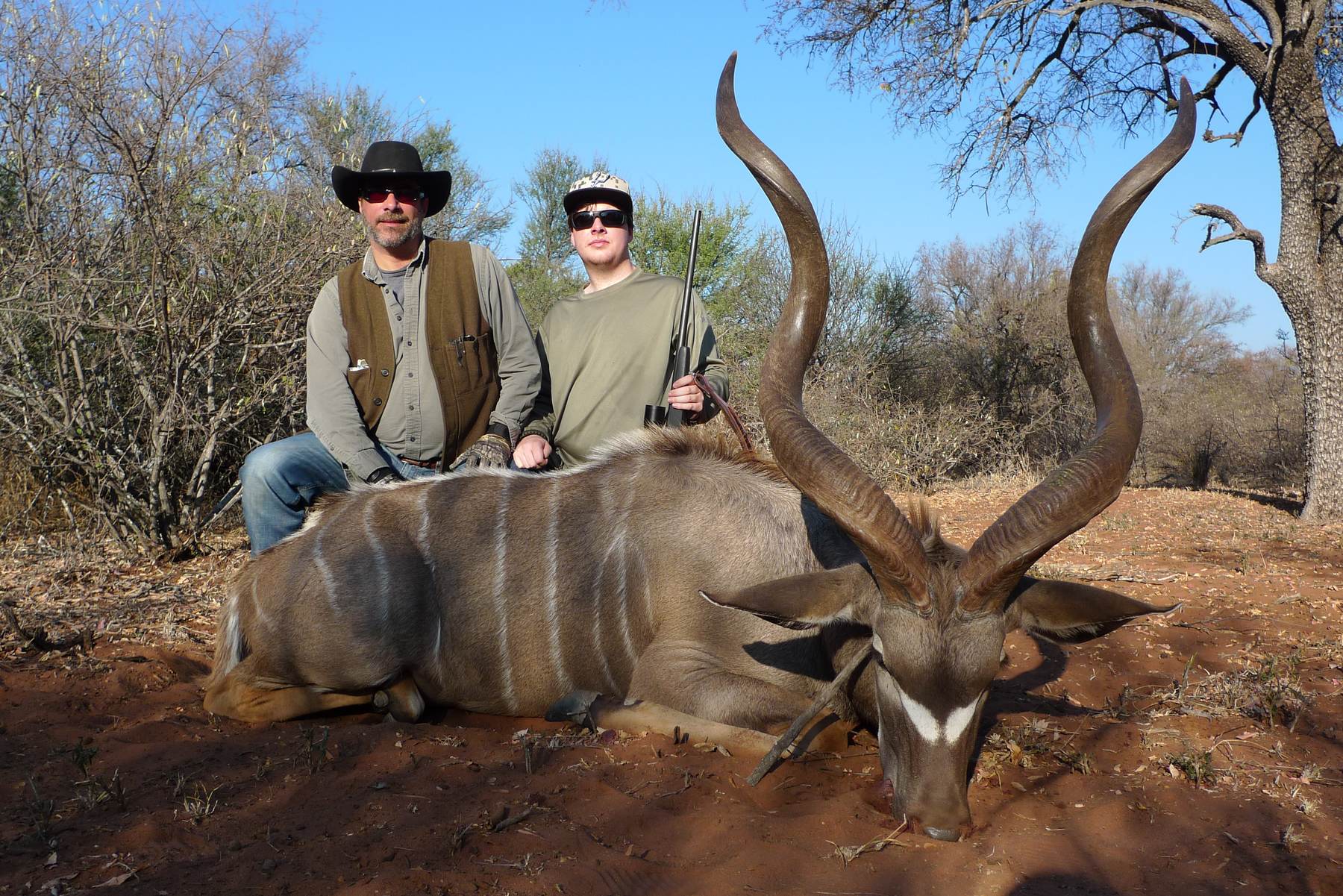 Two hunting clients with a kudu bull taken in Limpopo, South Africa