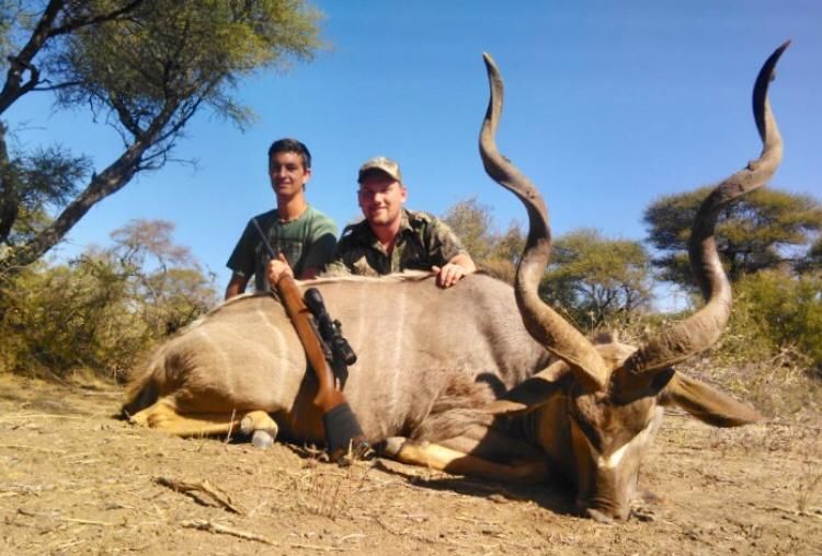 Two hunting clients with a kudu bull taken in Limpopo, South Africa