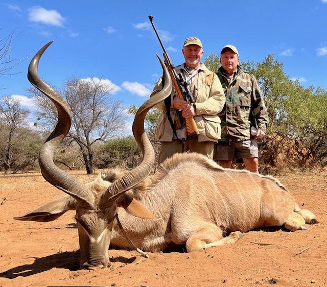 Two hunters with a heavy kudu bull taken in Limpopo, South Africa