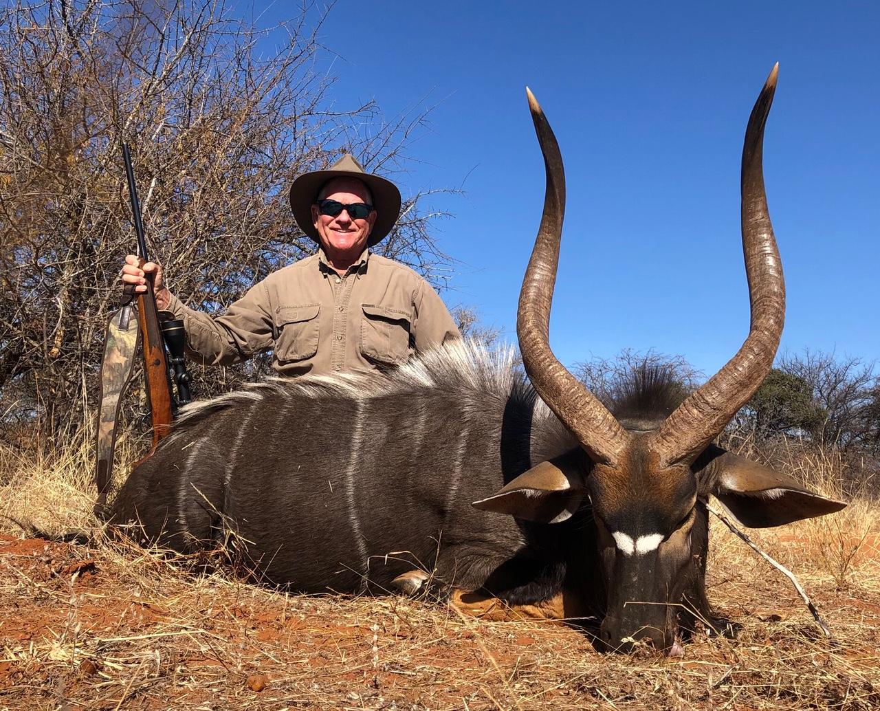 Hunting client with a nyala bull taken in Mozambique