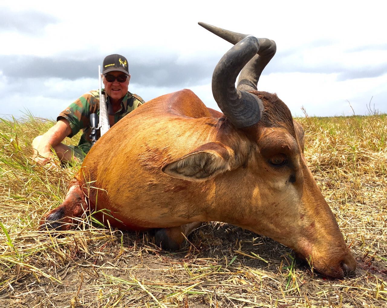 Hunting client with a red hartebeest bull taken in Limpopo, South Africa