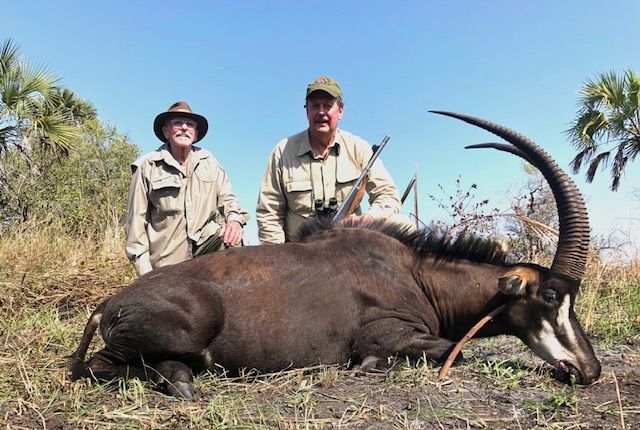 Two hunting clients with a sable bull taken in the Zambezi Delta, Mozambique