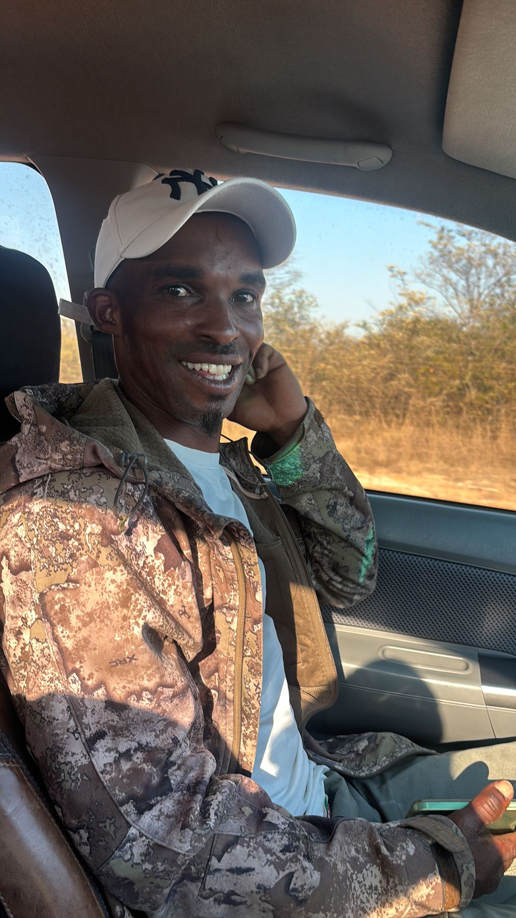 Solly, head tracker for Nhoro Safaris, in the hunting vehicle on the way out at first light